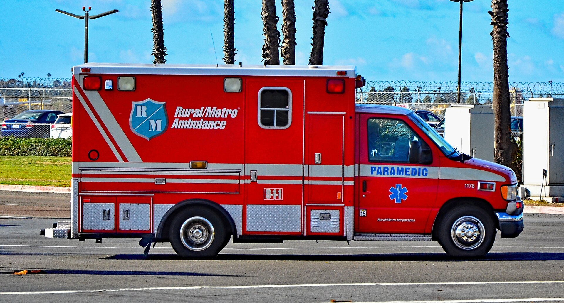 Paramedic beside a Berlin EMS ambulance ready to respond