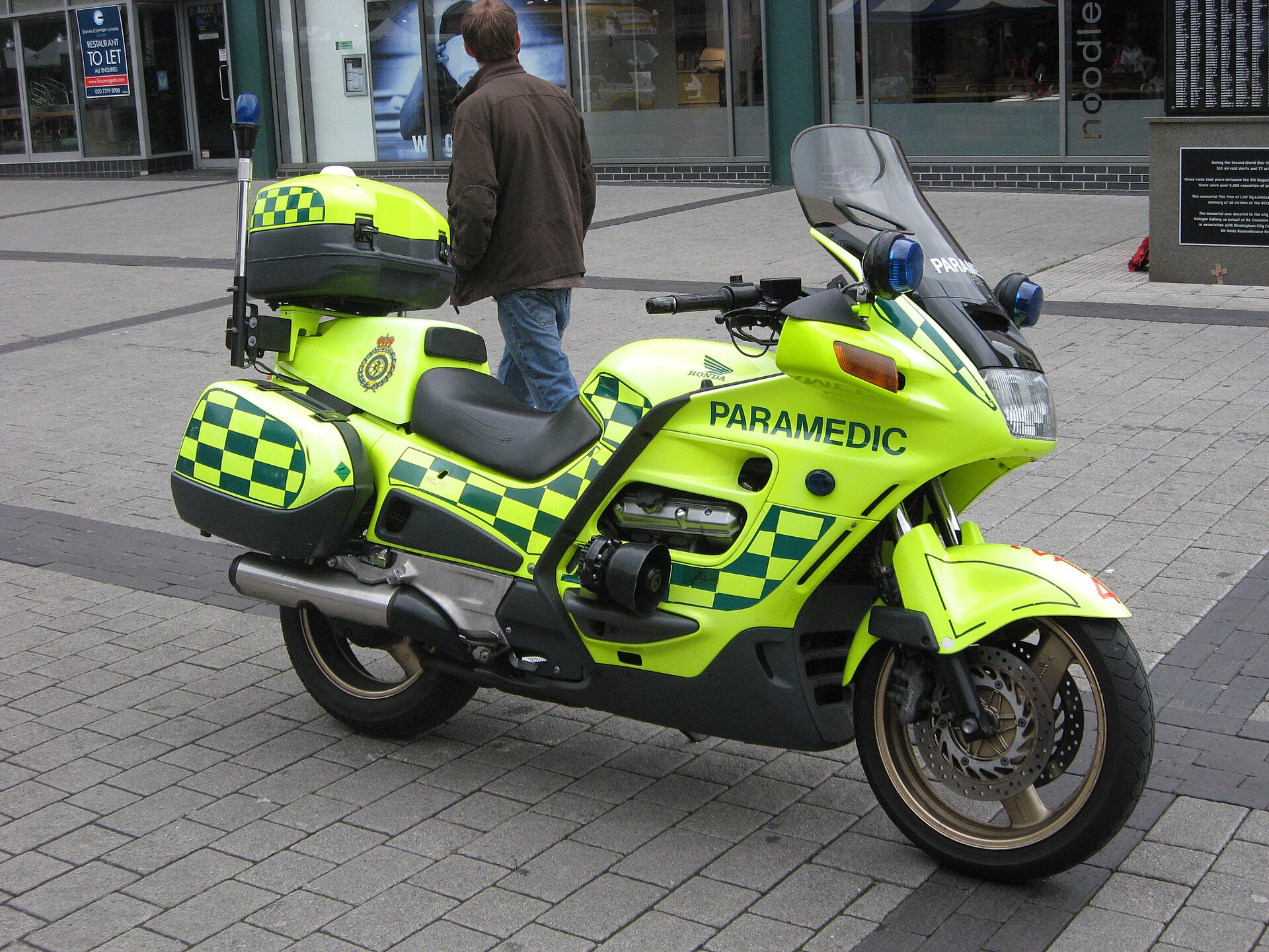 Paramedic on duty beside an ambulance